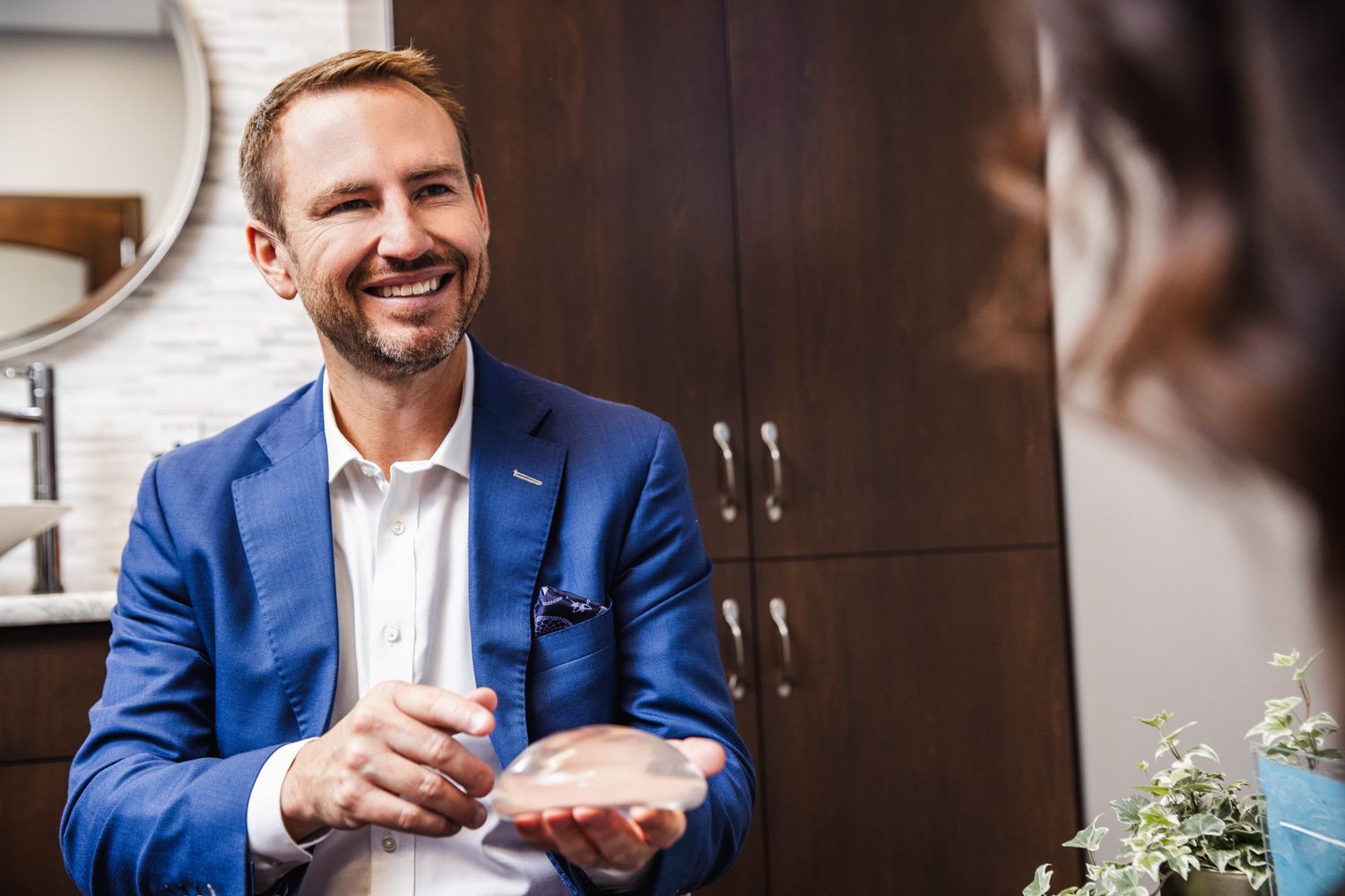 Consultation about cosmetic surgery options and implants.