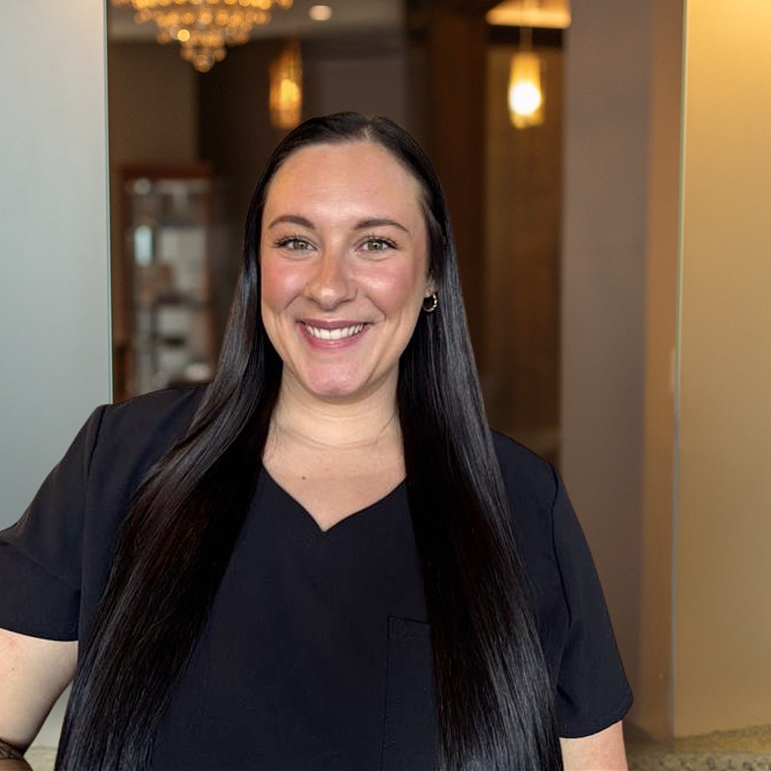Smiling woman in a professional setting.