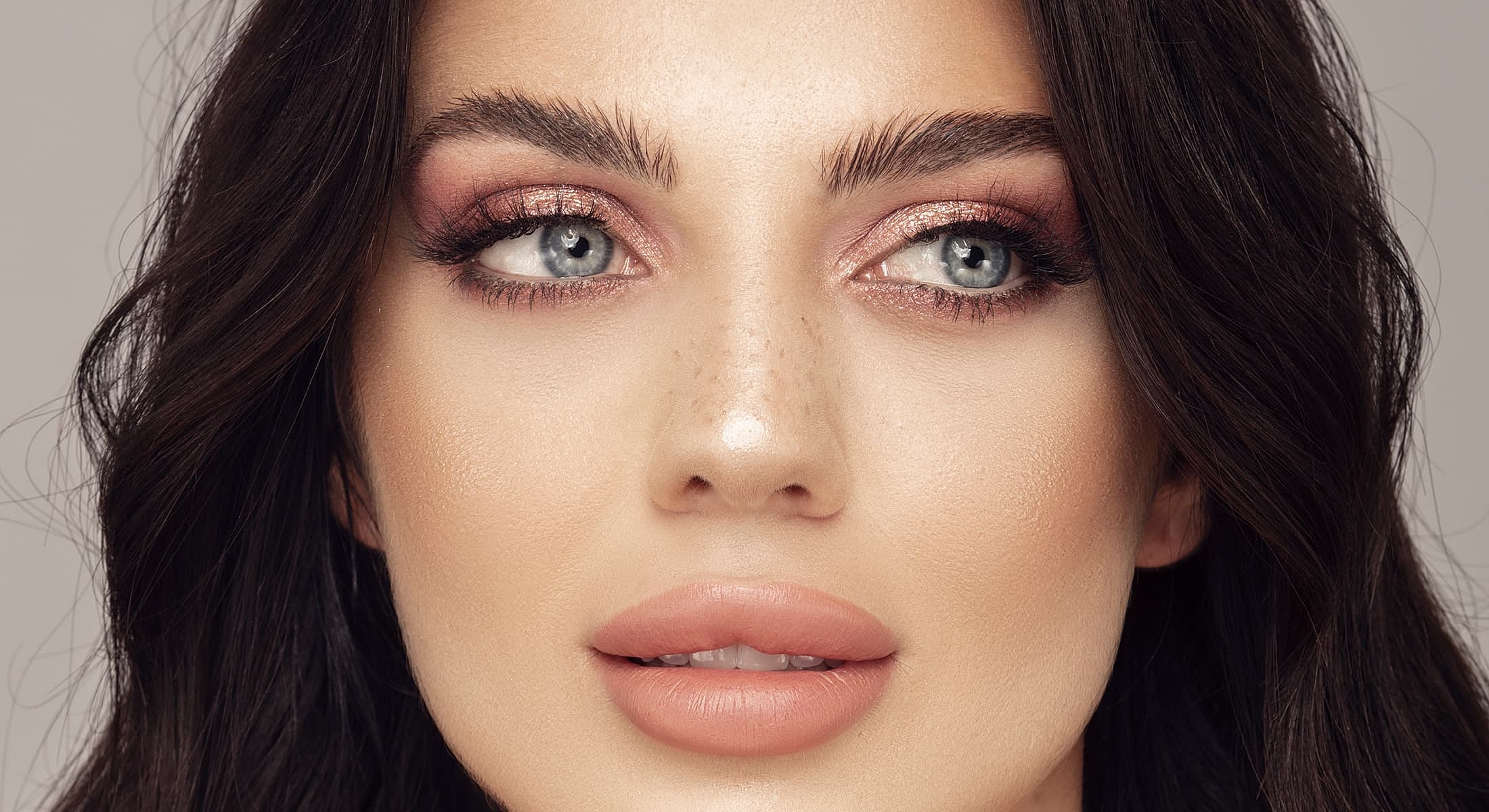 Glen Carbon Juvederm model with makeup and clear skin.